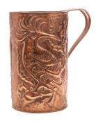 An Arts & Craft embossed copper mug: decorated with crested birds, crown, sun and Greek letters,