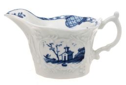 A First Period Worcester creamboat: of rounded hexagonal form moulded with panels of fruiting