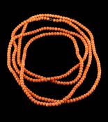 A long coral bead single-string necklace: each bead approximately 4.5mm, 44gms gross weight.