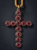 An early 19th Century gold and foiled garnet pendant cross: composed of eleven rosette circular