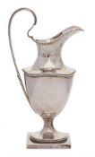 A late Victorian silver pedestal cream jug, maker Haseler Brothers, London,