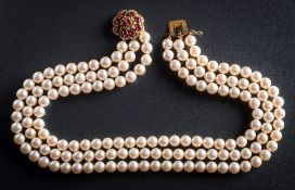 A cultured pearl three strand choker necklace with attached 18ct gold,