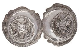 A pair of Continental silver dishes, stamped 900: of circular outline with wavy edge border,