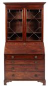 An early 19th Century mahogany bureau and associated bookcase:,