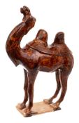 A Chinese pottery figure of a Mongolian camel: modelled in the Tang Dynasty manner standing four