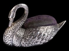 An Edwardian novelty silver pin cushion, maker S & Co, Birmingham, 1907: in the form of a swan, 7.