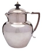 A Victorian silver hot water jug and cover, maker James Deakin & Sons, Sheffield, 1896: initialled,