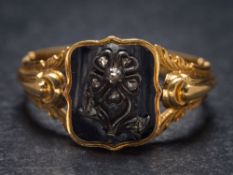 A mid 19th Century black enamelled gold and diamond mourning ring: with rose diamond-set