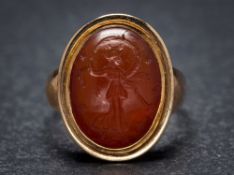 A Roman cornelian intaglio mounted seal ring: the intaglio possibly depicting Ceres,