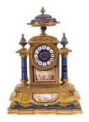 A French gilt-metal and porcelain mantel clock: the eight-day duration movement striking the hours