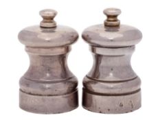 A pair of Elizabeth II silver pepper and salt mills, maker M C Hersey & Sons Ltd, London,