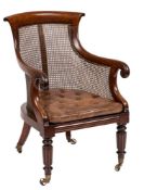 A William IV mahogany bergere armchair:, with curved bar 'paper scroll' toprail,