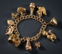 A 9ct gold curb-link bracelet: with eleven various attached 9ct gold charms to include squirrel,