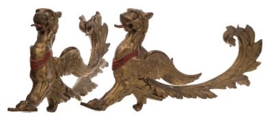 A pair of 19th century gilt brass London Griffon wall appliques: open mouthed with tongue,