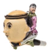 A late 19th century Chinese porcelain pipe bowl: in the form of a Chinese man riding the moon,