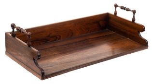 A 19th Century rosewood book trough: of rectangular outline,