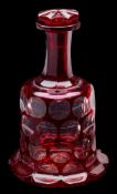 A Bohemian ruby flashed decanter: of mallet shaped form with petal base and raised octagonal neck,