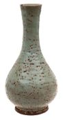 A Chinese celadon glazed vase: of tear drop form with slender mildly waisted neck,