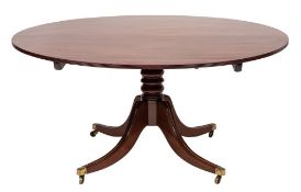A Regency mahogany circular dining table:, the snap top with a reeded edge,