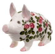 A large Bovey Wemyss pig: modelled seated and decorated with flowering clover, painted Wemyss Ware,