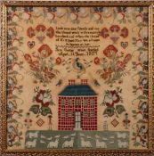 A 19th century woolwork sampler: with central verse and figures beside a mansion house with a