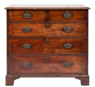 A George III mahogany rectangular chest: the top with a moulded edge containing two short and three