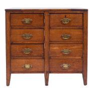 A 19th Century mahogany rectangular chest:, containing eight short drawers, having pine sides,