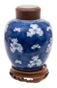 A Chinese blue and white vase and a similar small ginger jar: the first painted with scrolling