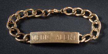 A 9ct gold 'Medic-Alert' identity bracelet: approximately 29gms gross weight.