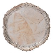 A late Victorian silver waiter, maker Goldsmiths & Silversmiths Co, London,