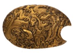 A Chinese gilt bronze dragon belt-hook: cast in relief with a sinuous dragon amongst flame scrolls,