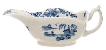A rare First Period Worcester low-footed sauceboat: press-moulded with foliate and scroll