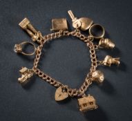 A 9ct gold charm bracelet: with various attached gold charms to include single stone ring and key,