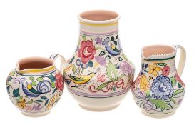 A Poole Pottery vase and jug and a further jug: decorated after a design by Truda Carter,