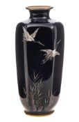 A small Japanese cloisonne vase: of hexagonal tapering outline decorated with flying cranes above