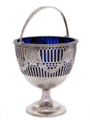 An Edwardian silver swing handled cream pail, maker Thomas Bradbury & Sons Ltd: monogrammed,