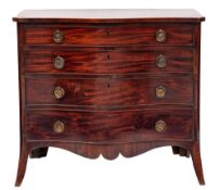 A George III mahogany serpentine-fronted chest in the Hepplewhite taste: the top with cut corners,