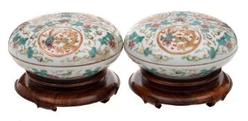 A pair of Chinese doucai circular boxes and covers: each decorated with three dragon and phoenix