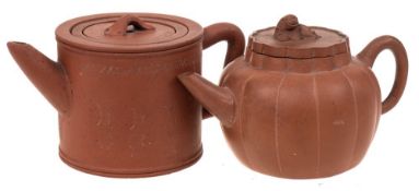 Two Chinese Yixing stoneware teapots: both of light brown hue,