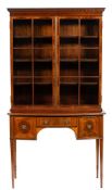 An Edwardian mahogany and inlaid display cabinet on a stand:,