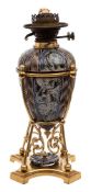 A Doulton Lambeth stoneware oil lamp: the base and reservoir decorated by Mark V.