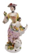 Two Meissen figures: the first of a shepherdess, wearing a yellow bodice,
