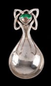 An Arts & Craft hammered silver and enamel caddy spoon, maker Ramsden & Carr, London,