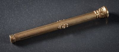 A gold on brass propelling pen/pencil: with fleur-de-lys seal end stone.
