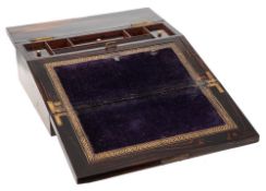 A Victorian coromandel and brass mounted lap desk: the hinged lid enclosing a velvet lined writing
