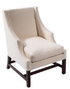An early 19th Century mahogany frame armchair:, fully upholstered in ivory coloured fabric,