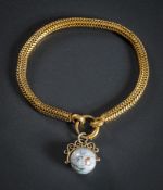 A 19th Century brazilian link bracelet: with attached globe charm.
