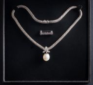 A cultured pearl and diamond mounted pendant: the cultured pearl approximately 14.