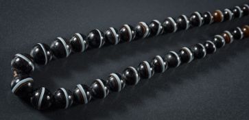 A banded agate bead single-string necklace: the beads graduated from 6mm to 16mm and on black