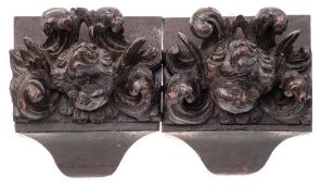 A pair of late 17th/early 18th century carved oak corbels: carved as angel's faces,